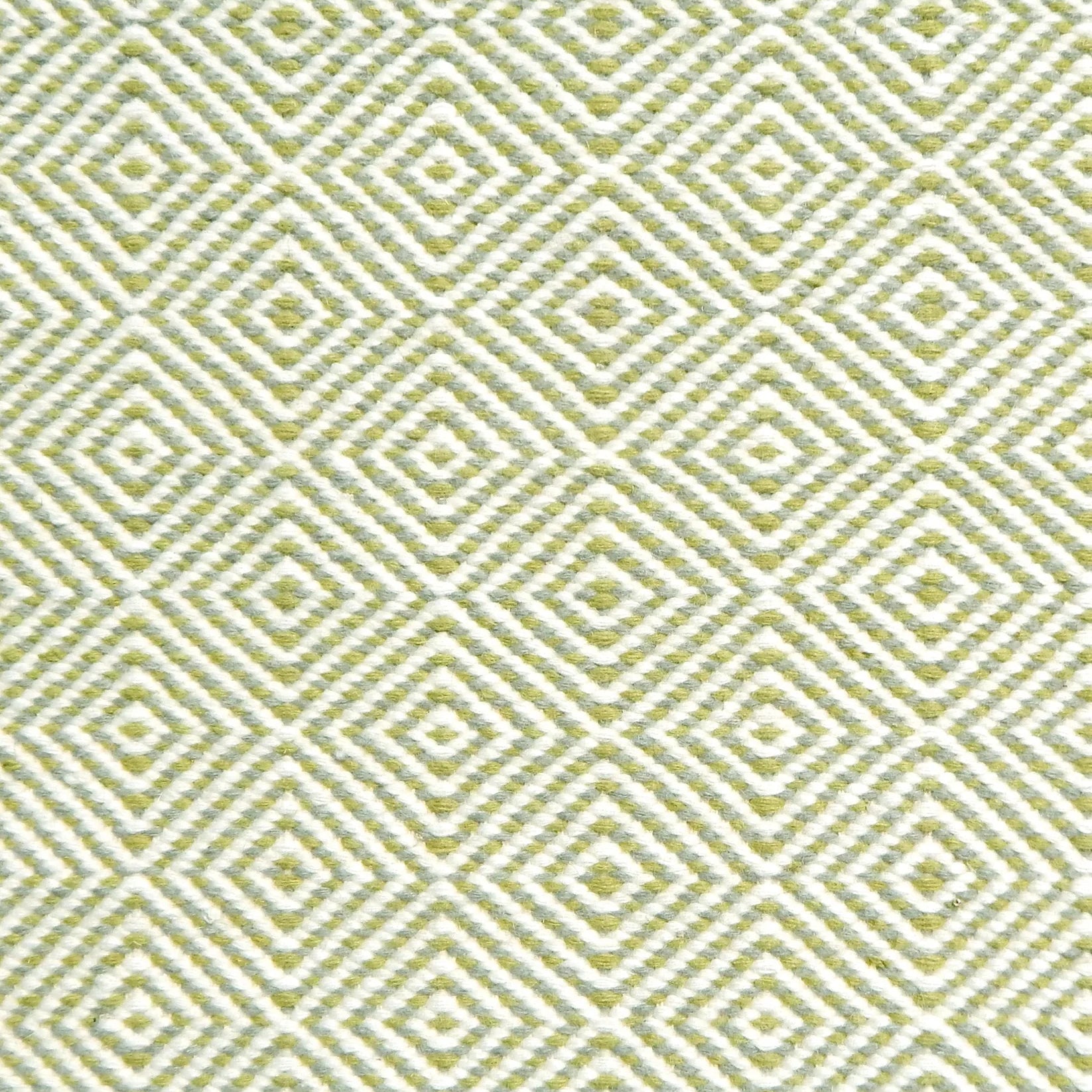 Handmade rug with concentric diamond pattern in white with lime green. 
