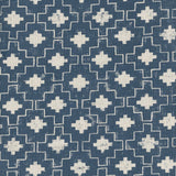 Detail of fabric in a geometric grid print in white on a navy field.