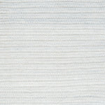 Close-up of a textured light gray woven rug