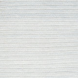 Close-up of a textured light gray woven rug