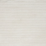 Close-up of a cream textured woven rug