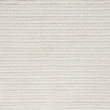 Close-up of a cream textured woven rug