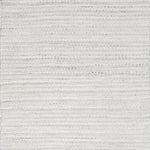 Close-up of white textured woven rug