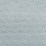 Patterned rug with geometric design in light green color