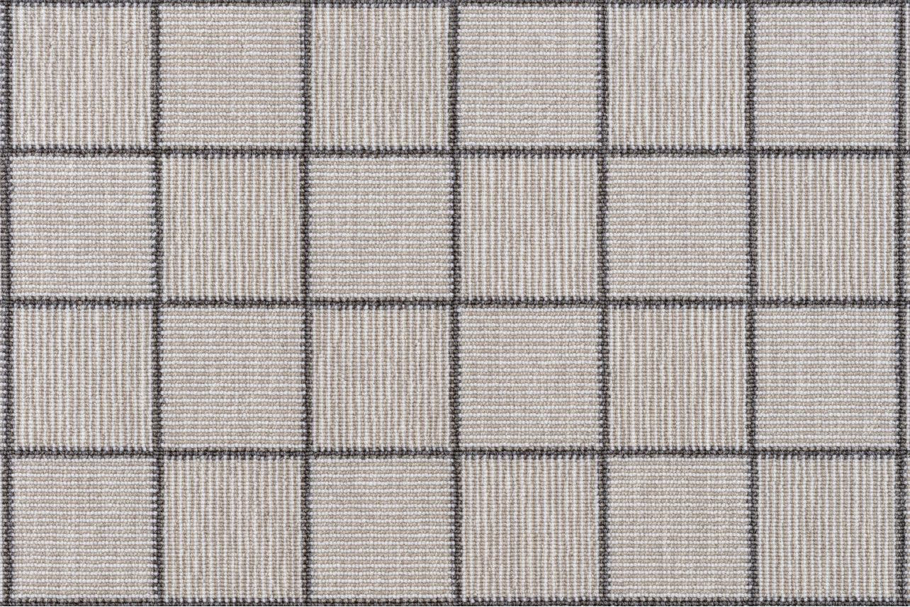 Broadloom carpet in a square grid with checkerboard stripes in shades of grey 