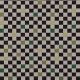 Jacquard fabric in a checked pattern in shades of yellow, green and black on a tan field.