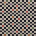 Jacquard fabric in a checked pattern in shades of yellow, pink, purple and black on a tan field.