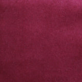 Detail of velvet fabric yardage in dark red.