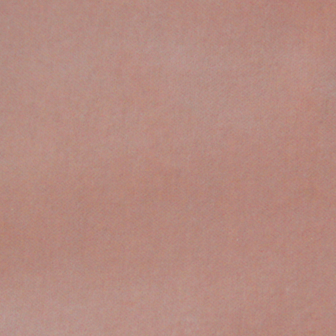 Detail of velvet fabric yardage in mauve.
