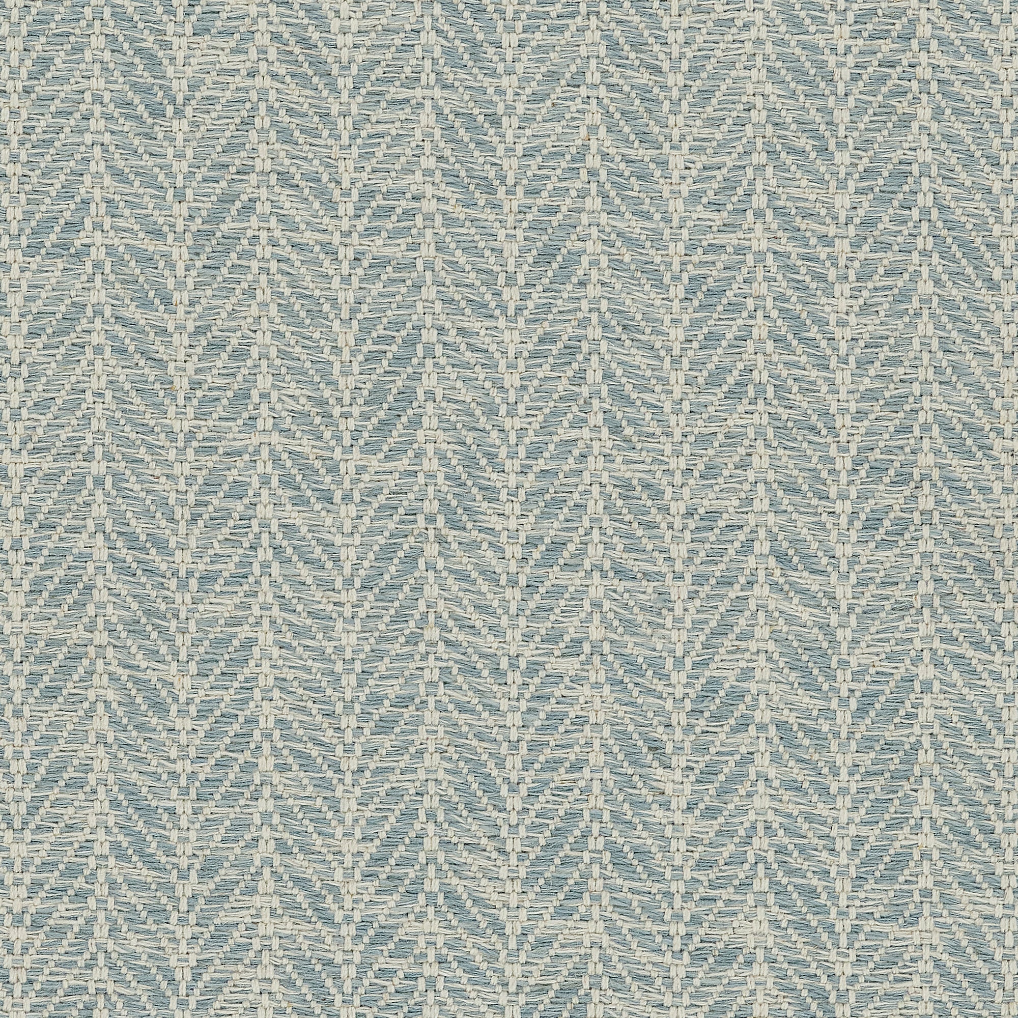 Broadloom carpet in a textural herringbone pattern in cream and pastel blue.