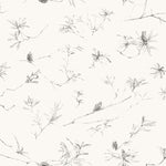 Detail of fabric in a painterly pine cone and branch print in green on a cream field.