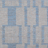 Handwoven rug detail in a dimensional design in blue and beige