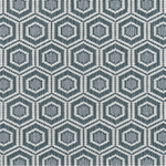 Broadloom carpet in a dimensional hexagonal lattice in white and teal.