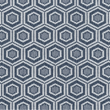 Broadloom carpet in a dimensional hexagonal lattice in white and navy blue.