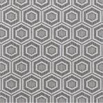 Broadloom carpet in a dimensional hexagonal lattice in white and taupe.