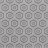 Broadloom carpet in a dimensional hexagonal lattice in white and taupe.