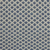 Handwoven rug with small scale diamond lattice in white on a blue field. 