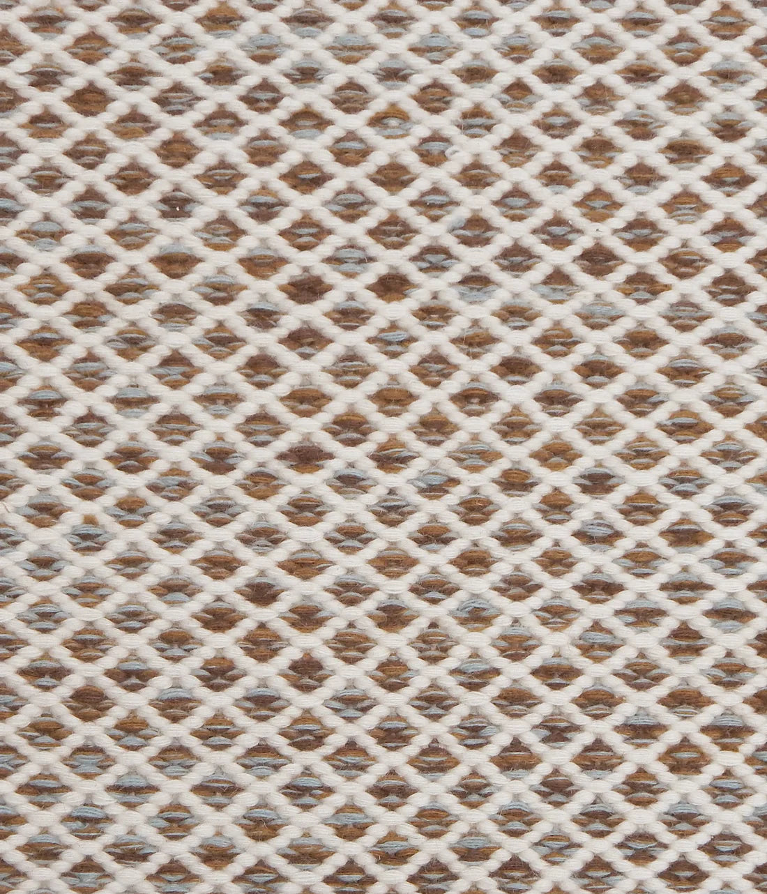 Handwoven rug with small scale diamond lattice in cream on a tan and brown field. 