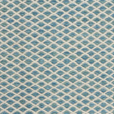 Handwoven rug with small scale diamond lattice in cream on a tan and marine blue field. 