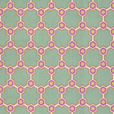 Detail of fabric in a geometric honeycomb pattern in shades of green, purple, white and orange.