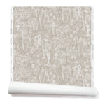 Partially unrolled wallpaper with a pattern of repeating watercolor illustrations of horses, farmers and country houses in white on a tan background.