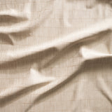 Close up of gently draped woven Indoor-Outdoor fabric with thin hand drawn stripe grid in ivory on ecru.