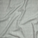 Close up of gently draped woven Indoor-Outdoor fabric with thin hand drawn stripe grid in ivory on sea foam blue.