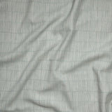 Close up of gently draped woven Indoor-Outdoor fabric with thin hand drawn stripe grid in ivory on sea foam blue.