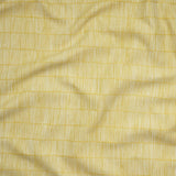 Close up of gently draped woven Indoor-Outdoor fabric with thin hand drawn stripe grid in ivory on yellow.