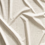 Close up of gently draped printed linen with thin hand drawn stripe grid in ivory on taupe.