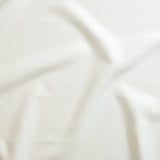 Close up of gently draped woven Indoor-Outdoor fabric with thin hand drawn stripe grid in white.