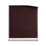Roll of grasscloth with dashed striped grid in crimson on plum purple.
