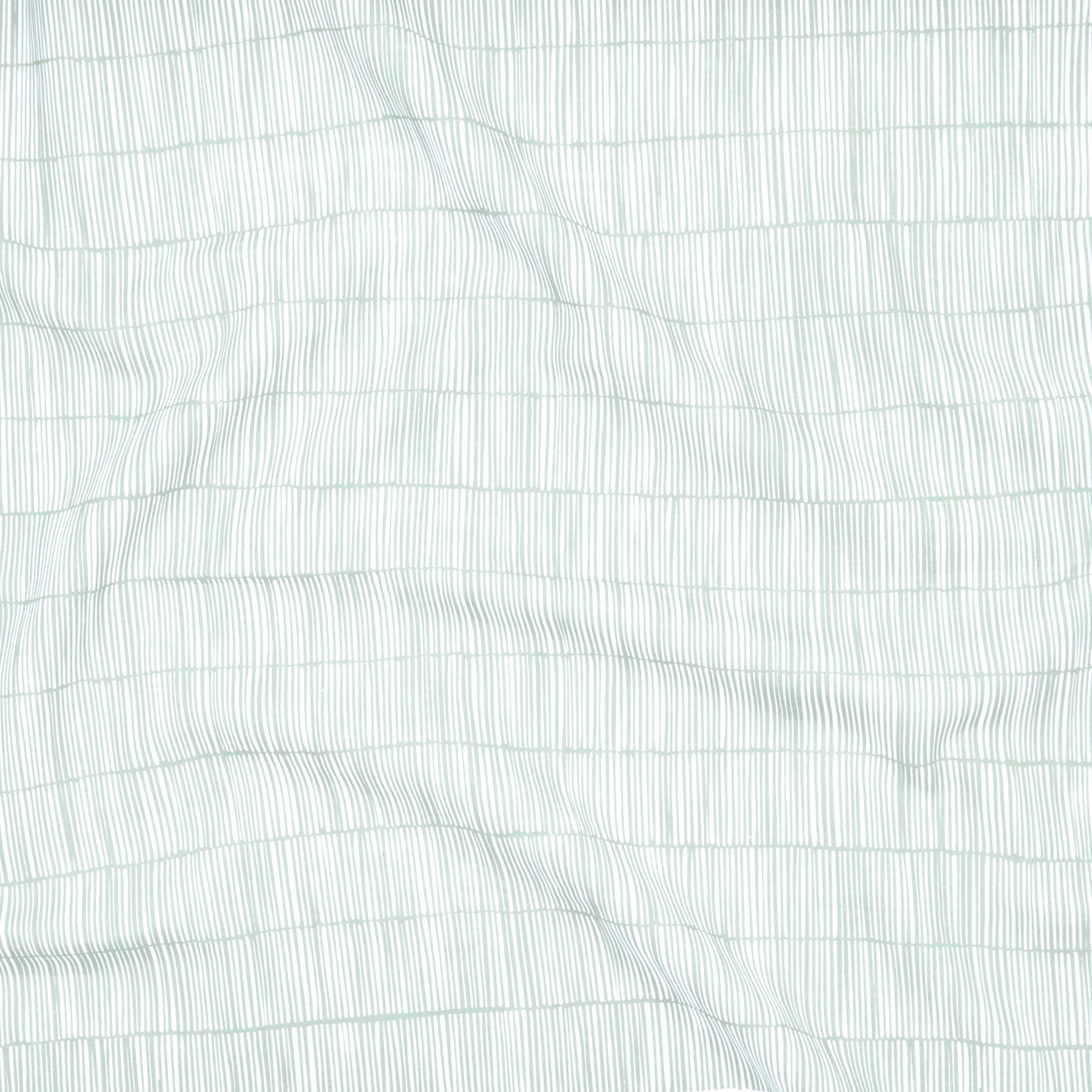 Close up of gently draped printed linen with thin hand drawn stripe grid in ivory on light blue.