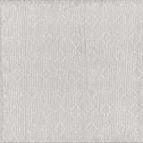Detail of fabric in a botanical lattice print in light gray.