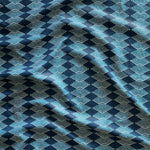 Close up of gently draped printed linen with linear stacked diamond stripe in shades of navy blue.