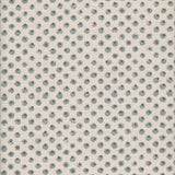 Detail of fabric in a painterly dot print in blue and brown on a cream field.