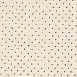 Detail of fabric in a painterly dot print in white and brown on a cream field.