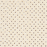 Detail of fabric in a painterly dot print in white and brown on a cream field.