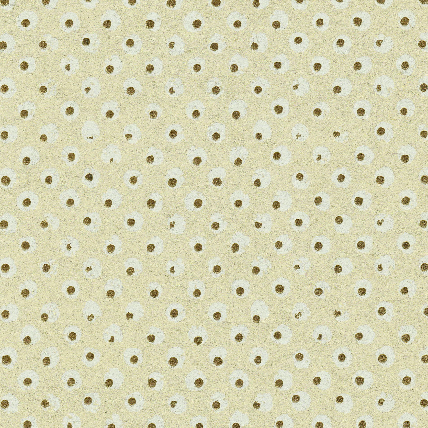 Detail of wallpaper in a painterly dot print in white and brown on a yellow field.