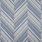 Broadloom carpet with a graphic herringbone pattern in shades of light blue and white. 