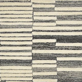 Broadloom carpet in a raised broken stripe pattern in cream on a charcoal grey field