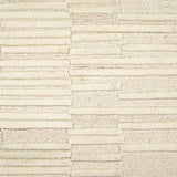 Broadloom carpet in a raised broken stripe pattern in cream on a cream field.