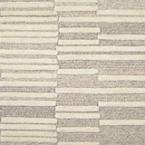 Broadloom carpet in a raised broken stripe pattern in cream on a grey field