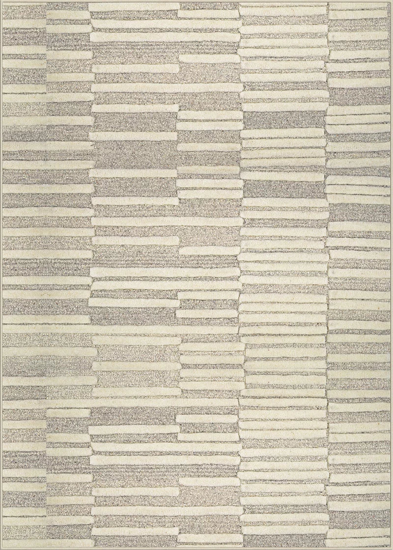 Broadloom carpet in a raised broken stripe pattern in cream on a  on a grey field