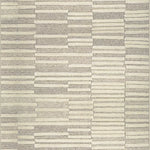 Broadloom carpet in a raised broken stripe pattern in cream on a  on a grey field