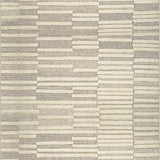 Broadloom carpet in a raised broken stripe pattern in cream on a  on a grey field