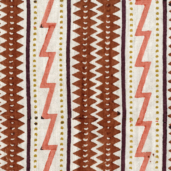 Fabric in a playful stripe and zigzag pattern in shades of brown, coral and yellow on a cream field.