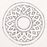 Detail of fabric in a repeating circular geometric print in gray on a white field.