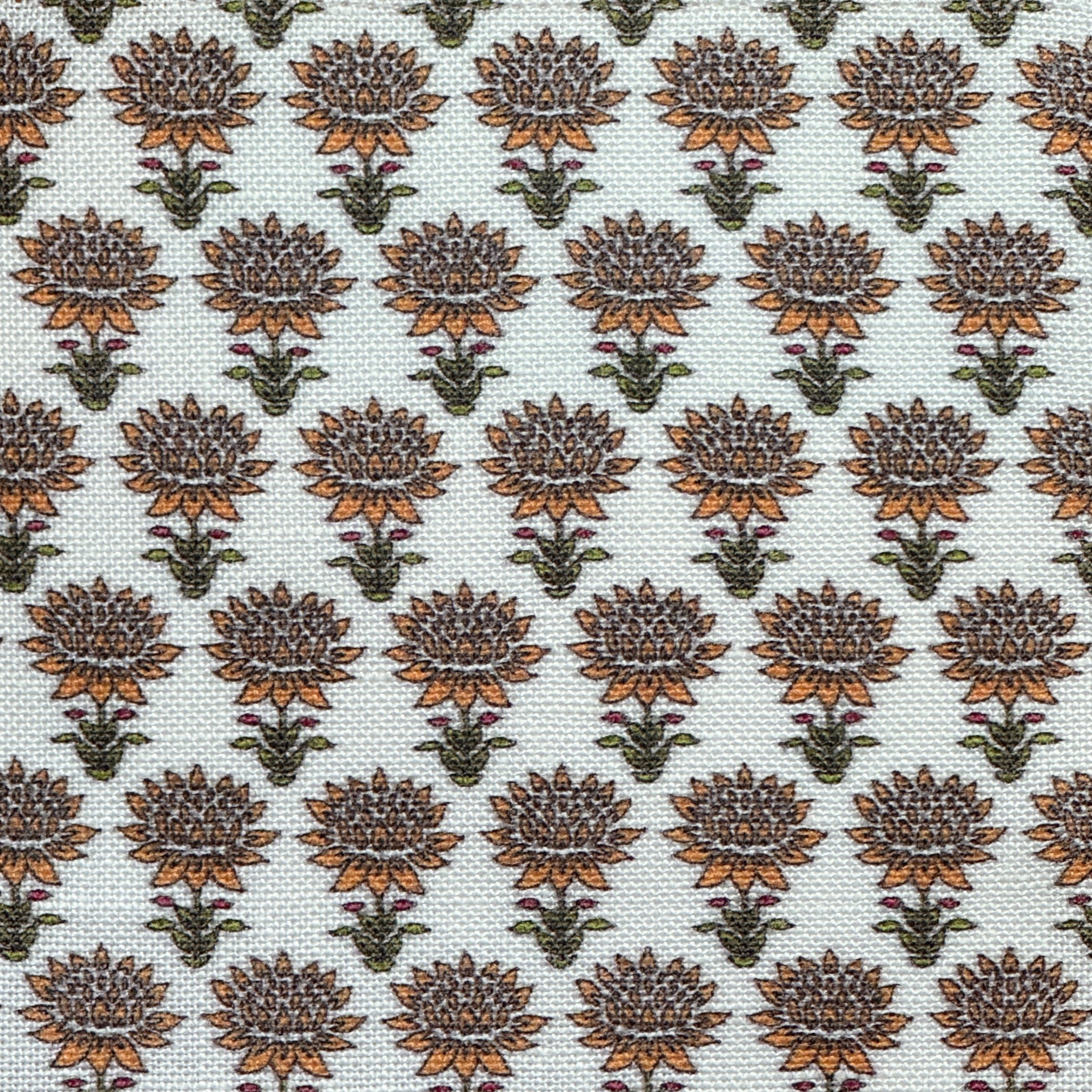 Patterned fabric with orange and green floral design on a light background