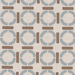 Detail of fabric in a round geometric grid print in light brown and blue on a tan field.